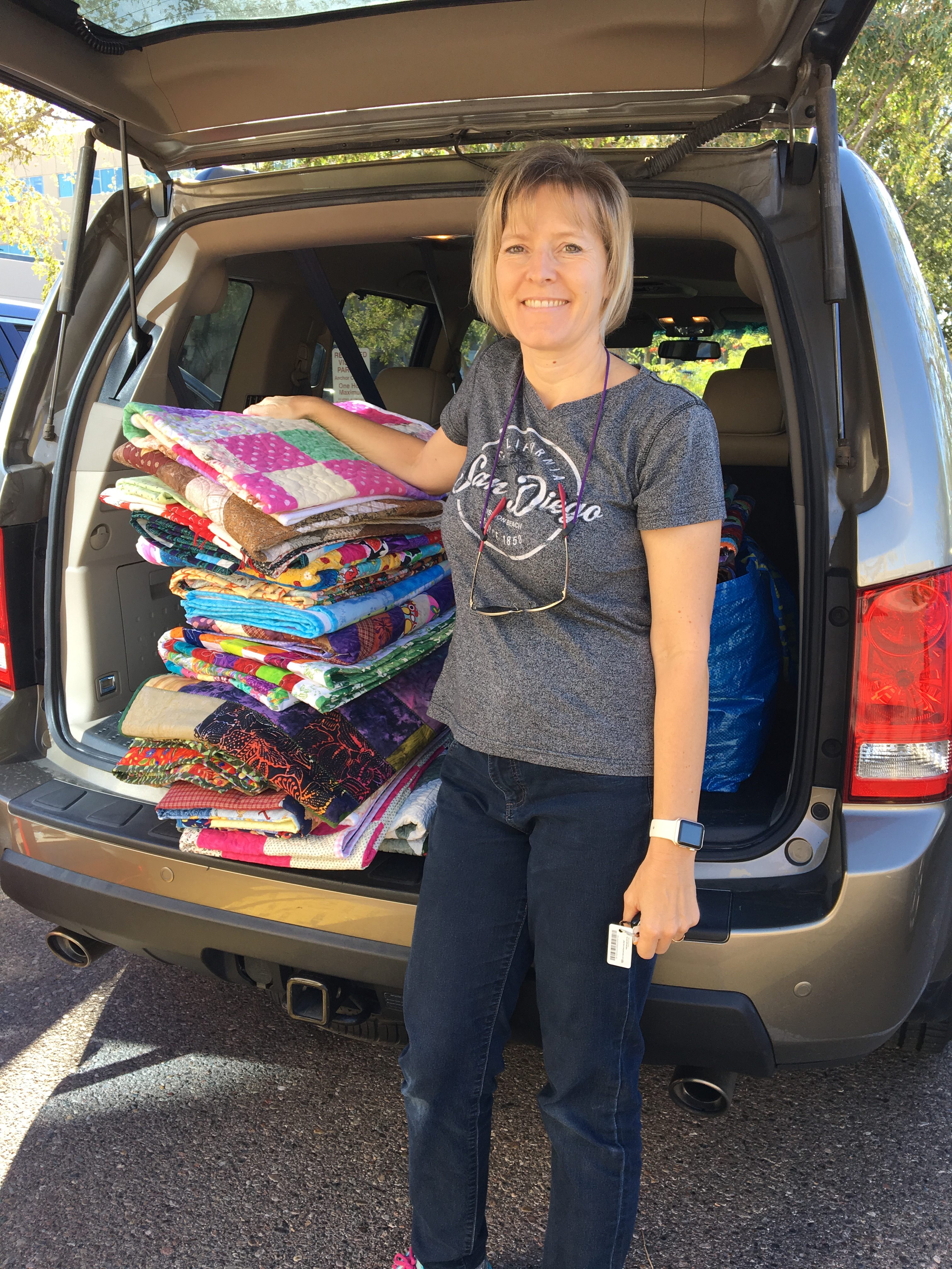 Delivering quilts to the American Red Cross for disaster relief.